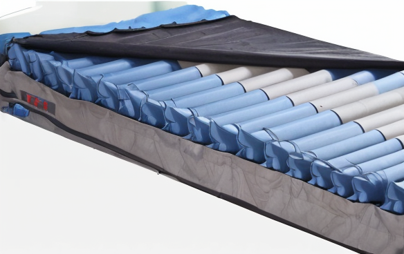 Cross-section of mattress showing multi-zone design with blue and grey layers