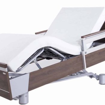 a hospital bed with a mattress on top of it.